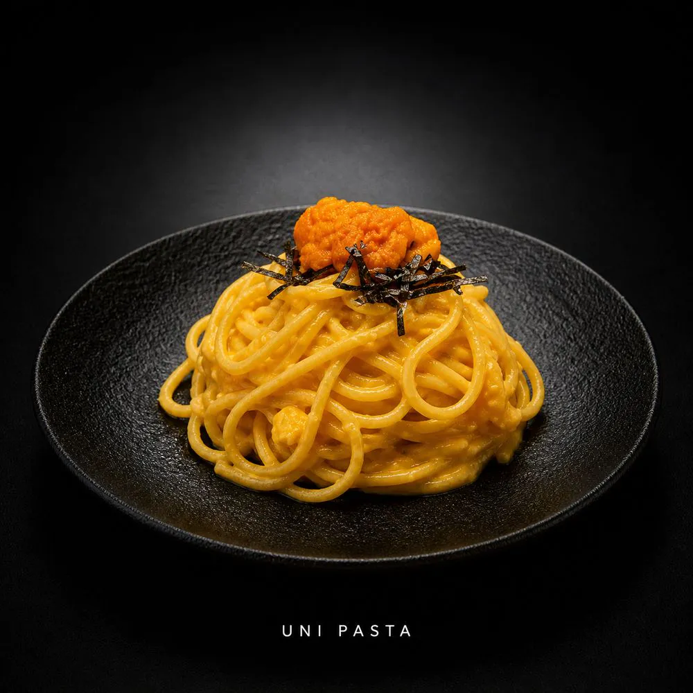 Creamy uni pasta topped with sea urchin and nori strips at Nami Sushi Ramen, a Japanese Restaurant in Los Angeles